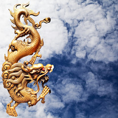 Fototapeta na wymiar Golden dragon statue on the sky