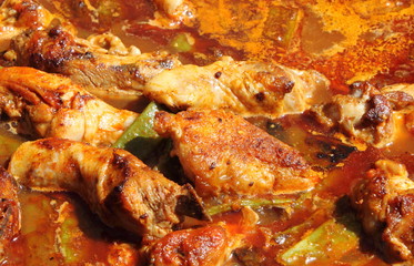 Creole chicken cooking