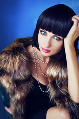 Beautiful woman in a fur coat.
