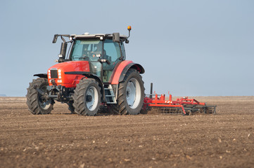 Naklejka premium Tractor plowing