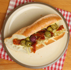 Baguette with Sun Dried Tomatoes, Olives and Cheese