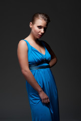 alluring young female in blue dress