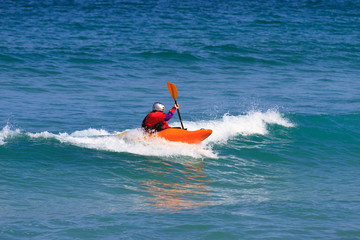 Man paddling a Sea kayak