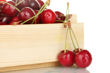 cherry in a wooden box on white background close-up