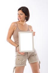 Fototapeta premium Beutiful girl holding a blank and white frame