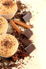 tasty muffin cakes with chocolate, spices and coffee seeds,