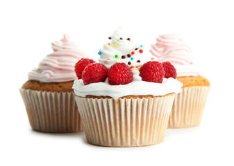 tasty cupcakes with berries, isolated on white