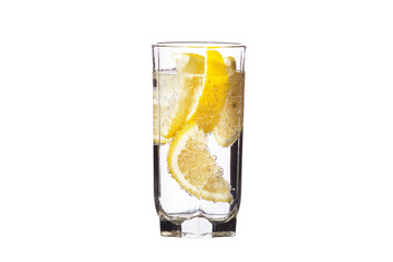 Full glass of water with lemon isolated on white background