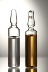 medical ampules on grey background