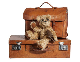 Well-Traveled Vintage Suitcase and Teddy Bear