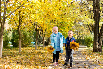 Fototapeta premium Brother and sister in autumn park