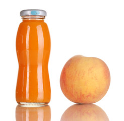 Delicious peach juice in glass bottle and peach next to it