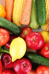Assortment of fresh vegetables and fruits as a background