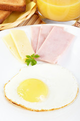 Breakfast. Fried eggs with cheese and ham