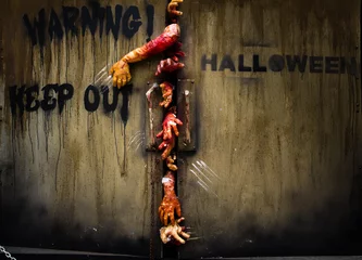 Fotobehang zombie hand through the door, useful for some Halloween concept © Satit _Srihin