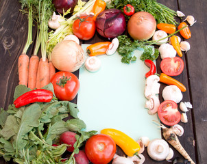 Paper for recipes on wood backround with vegetable