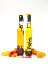 Olive oil in bottle and peppers