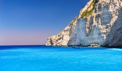 Boat anchored on Navagio beach (also known as shipwreck beach), 