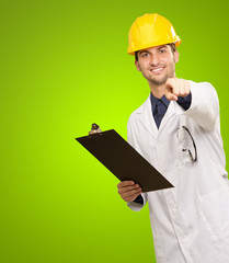 Architect Holding Clipboard And Pointing