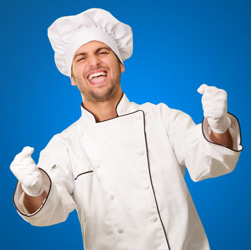 Portrait Of Male Chef Cheering