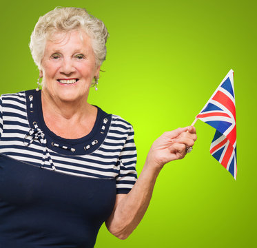 Happy Senior Woman Waving United Kingdom Flag