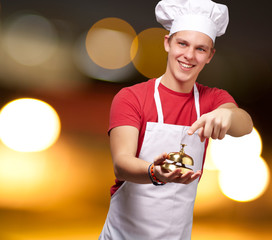 Portrait Of A Happy Man Holding Bell