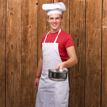 Portrait Of A Chef Holding Pan