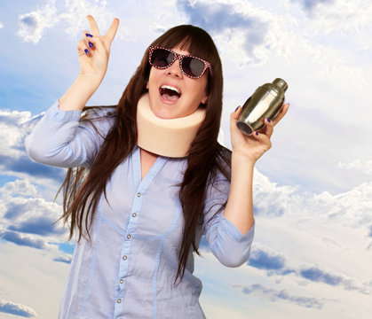 Woman Wearing Neckbrace Holding A Shaker