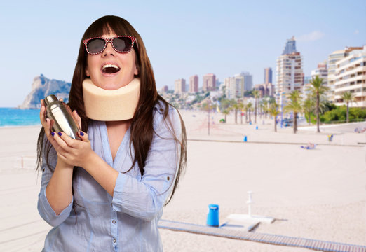 Woman Wearing Neckbrace Holding A Shaker