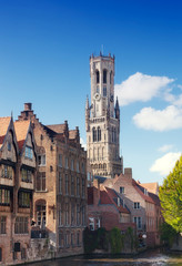 Fototapeta premium Classic view of channels of Bruges..Tower Belfort in Bruges