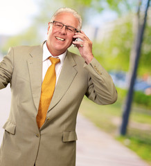 Senior Business Man Talking On Phone