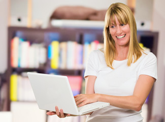Happy Woman Looking At Laptop