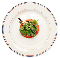 Caprese appetizer on plate, isolated