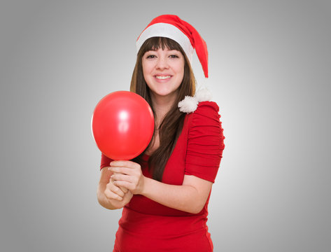 happy christmas woman holding a balloon