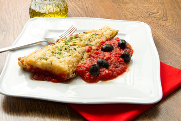 cooked cod loins with home made tomato sauce and oil