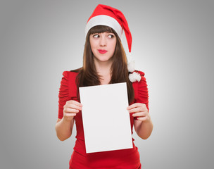 worried christmas woman holding a blank card