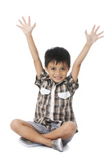 happy boy with raised arms on white background