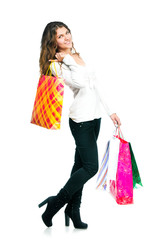 Pretty young woman holding shopping bags