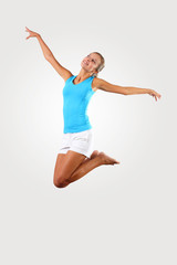 Fototapeta premium fitness woman jumping excited