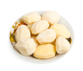 Raw potatoes on a plate