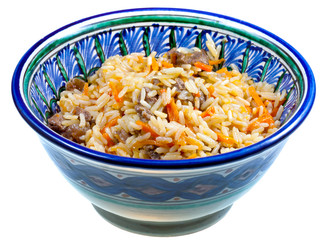 traditional asian pilau with meat in ceramic bowl