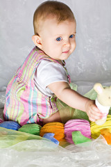 Little baby girl with toys