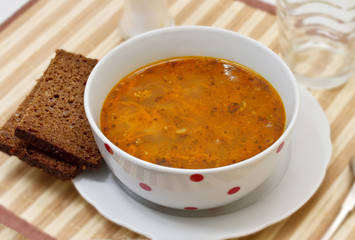 Rice soup with meat and carrots