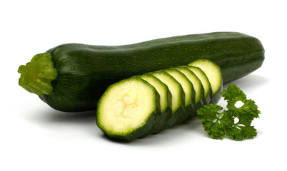Cut zucchini with parsley courgette isolated on white background