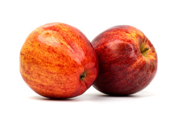Whole red apples isolated on white background.