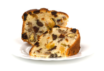 Sliced fruit cake on white plate