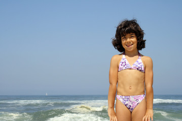 beautiful girl in bikini in the beach, summer photo