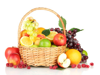 Assortment of exotic fruits in basket, isolated on white