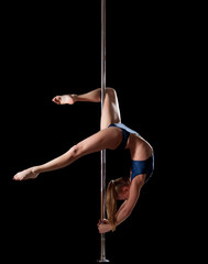 Woman show high gymnastic level during pole dance