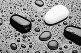stones of black and white pebbles with water drops